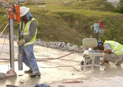 Workers drilling cores in concrete