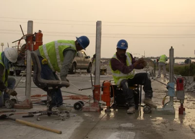 Workers drilling cores in concrete