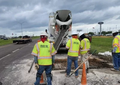 Workmen doing full depth concrete repair